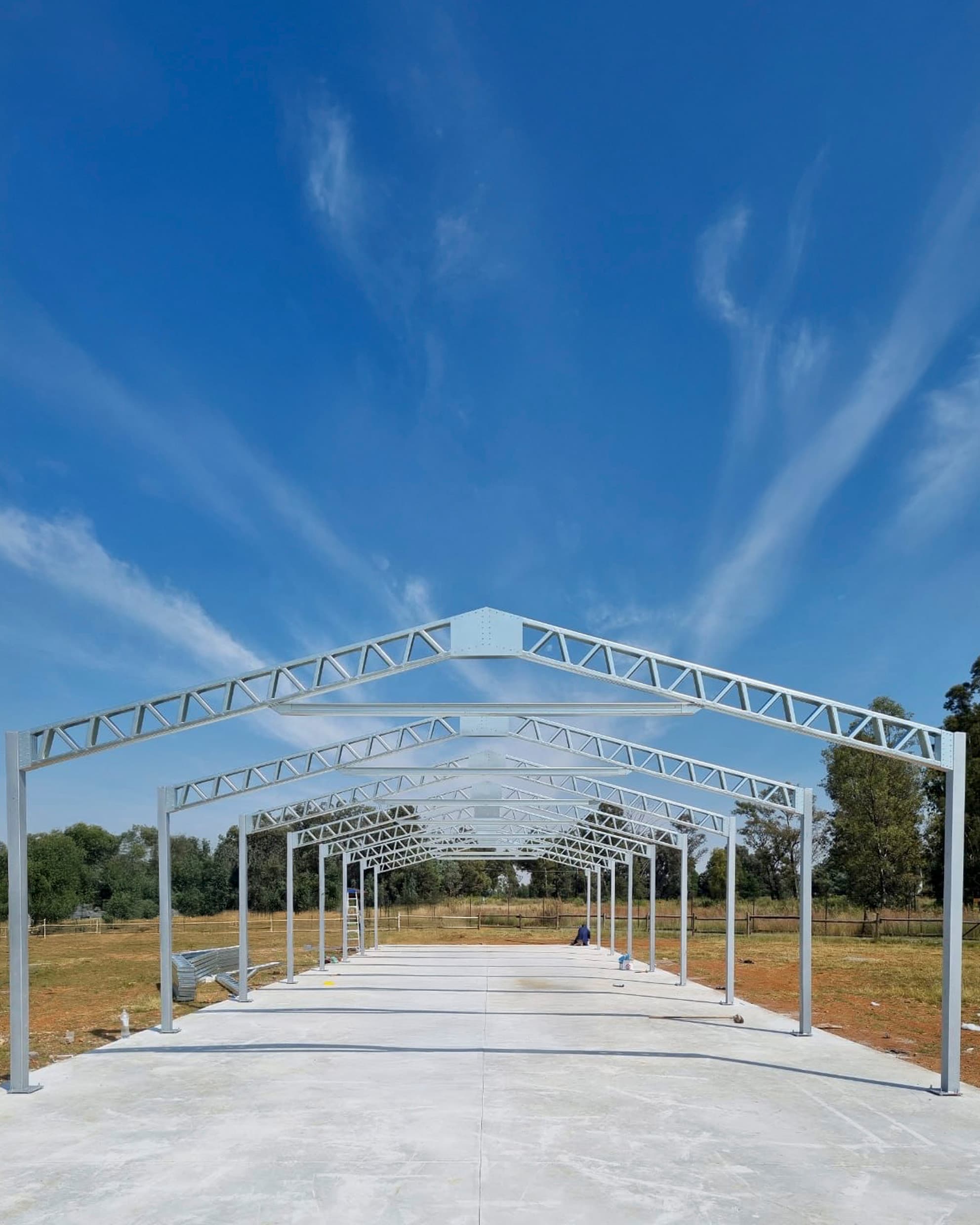 Large steel warehouse frontage with wide access opening